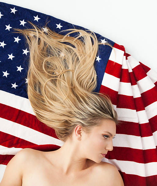 istock Beautiful woman with American flag 505259504