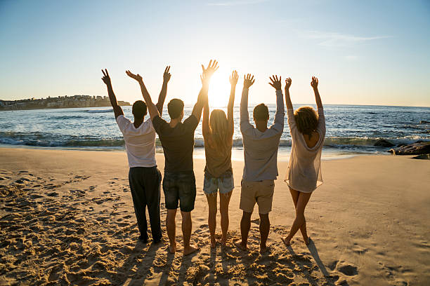 istock Friends enjoying the sunset at the beach 505259570