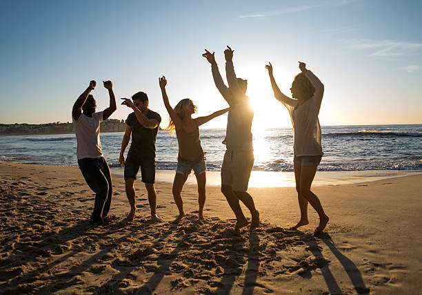 istock Friends partying at the beach 505259724