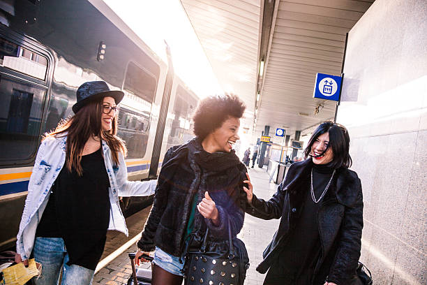 istock Friends at train station platform, tourist and commuters arriving 505259802