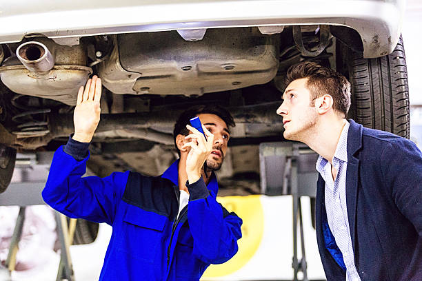 istock Auto Mechanic Talking With Car Owner 505260434