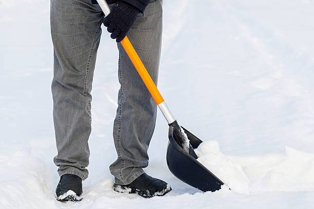 istock Man using snow shovel in winter 505260860