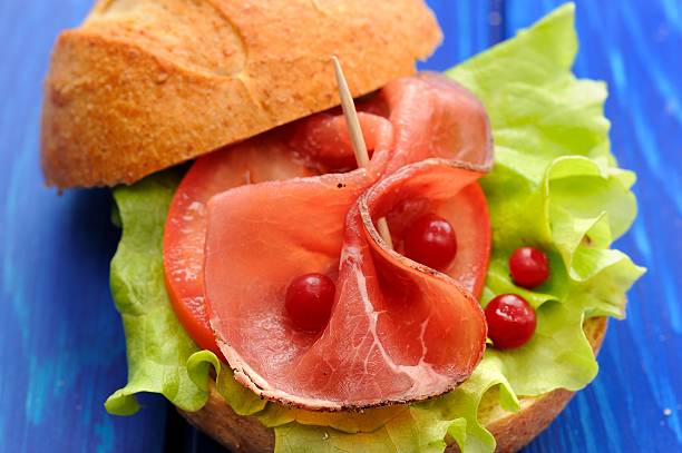 istock Nordic hamburger with ham, lettuce and fresh cranberries 505261726