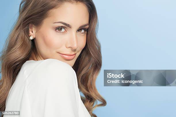 Young Woman Over Blue Stock Photo - Download Image Now - Beautiful Woman, Women, Jewelry