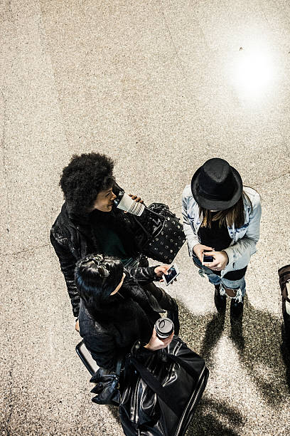 istock Friends waiting for the train inside the train station 505264340