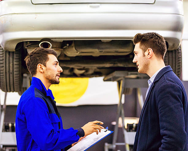 istock Auto Mechanic Talking With Car Owner 505264868