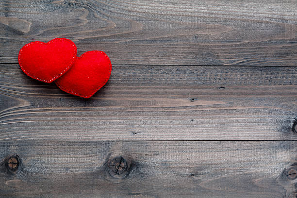 istock Aged wooden background with red heart 505265184