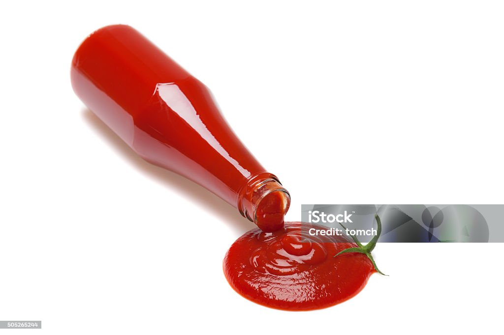 Ketchup tomato Ketchup is poured from a bottle in the shape of a tomato. Ketchup Stock Photo