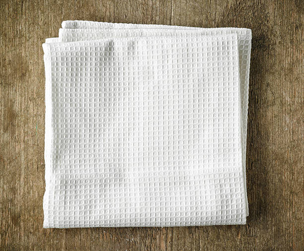 istock White towel on wooden table 505266572