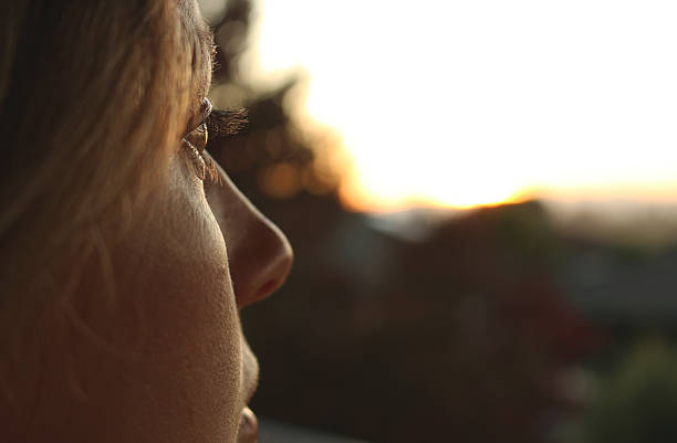 Young Woman Profile Close up Beautiful woman looking outside eye reflection stock pictures, royalty-free photos & images