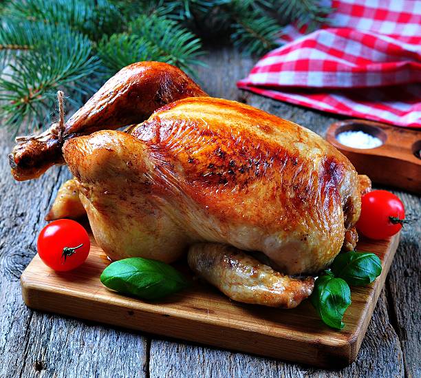 istock Roast chicken on a wooden table 505266986