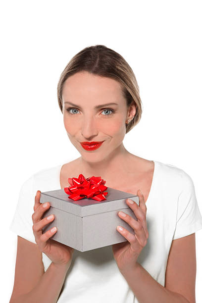 istock Woman holding a gift box 505267576