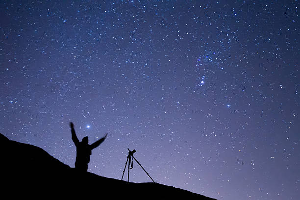 istock photographer shooting the starry sky seen from Meteora, Greece 505269210