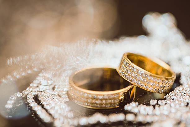 istock beautiful gold wedding ring with diamonds 505269752