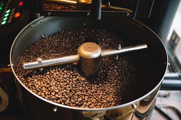 istock freshly roasted coffee beans n a coffee roaster 505270180