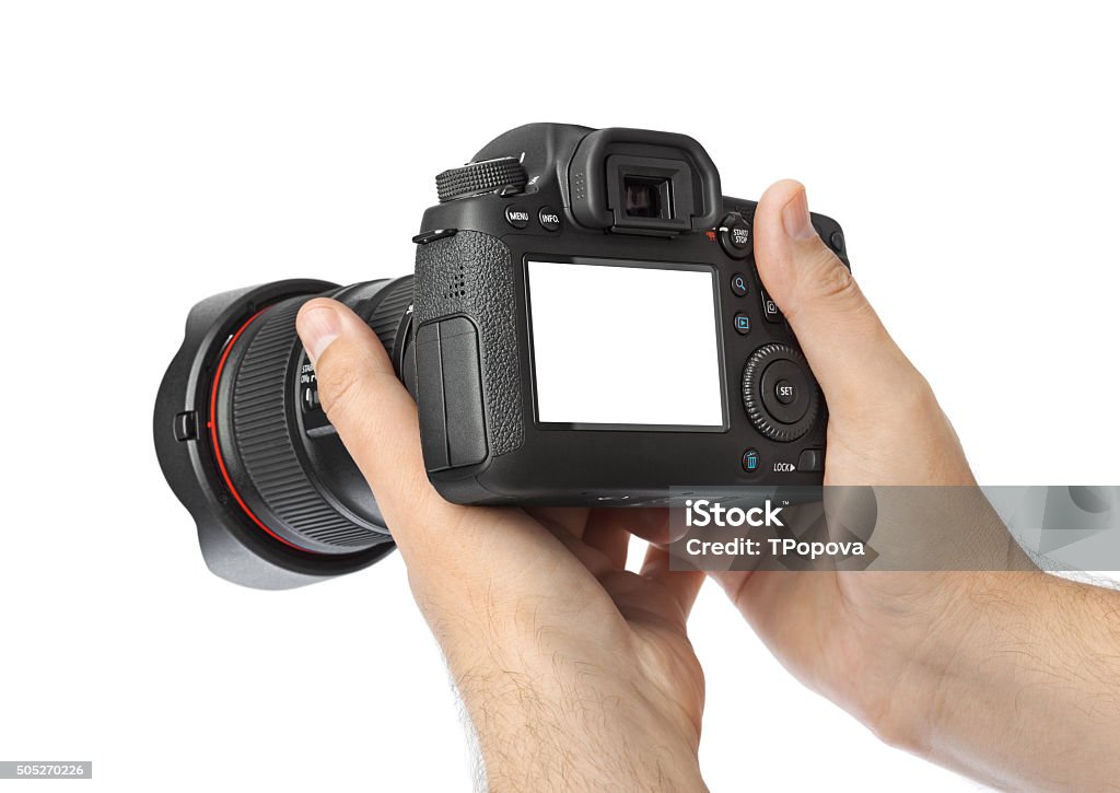 Photo camera in hand Photo camera in hand isolated on white background Camera - Photographic Equipment Stock Photo