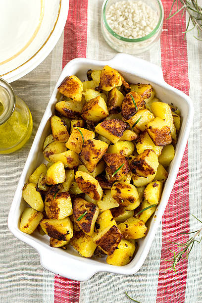 istock Roasted fried potatoes with garlic, rosemary 505272144