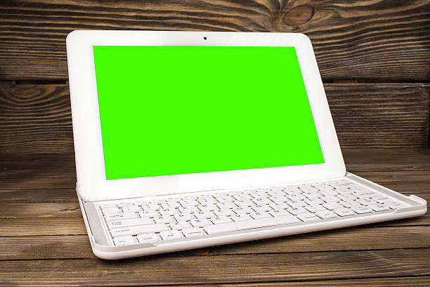 istock Open laptop isolated screen on old wooden desk. 505272332