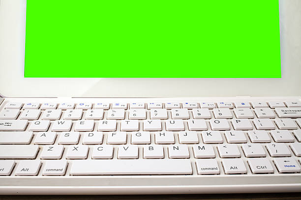 istock Open laptop isolated screen on old wooden desk. 505272824