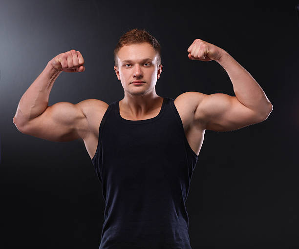 istock Healthy muscular young man. Isolated on black background 505273672