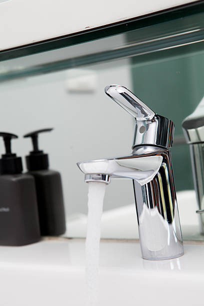 istock Water drop from a faucet in bathroom W.C. 505280803