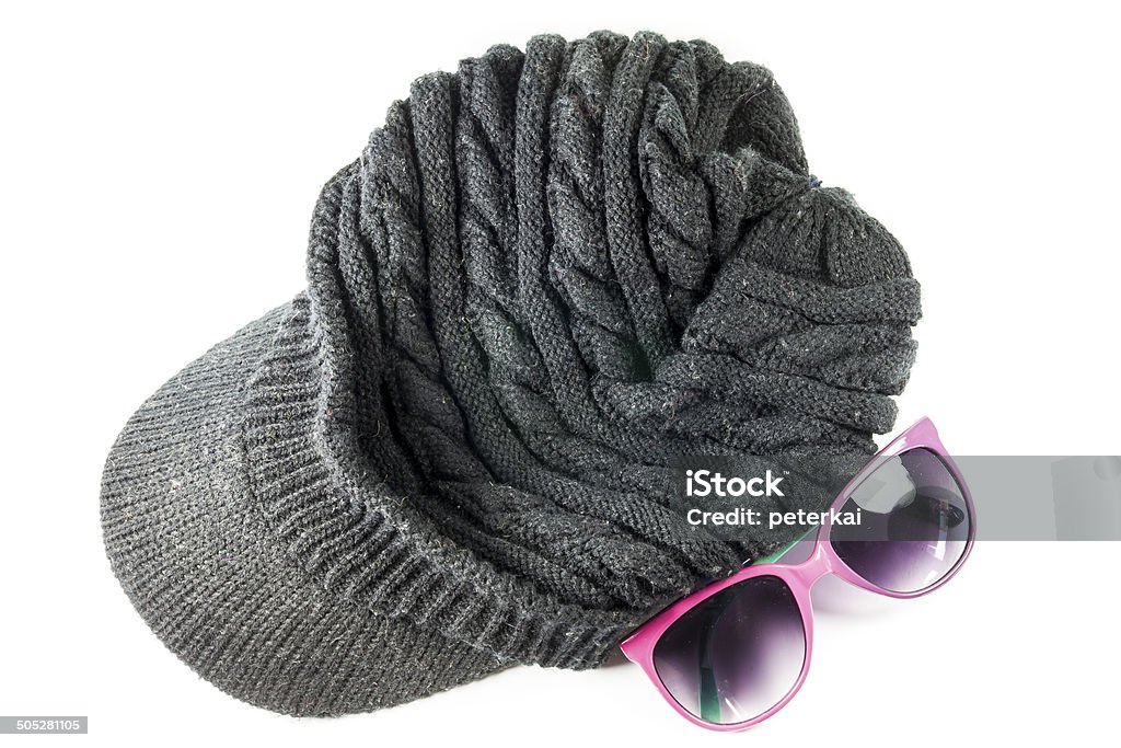 Black knitting wool hats Black knitting wool hats And sunglasses On white background Blue Stock Photo