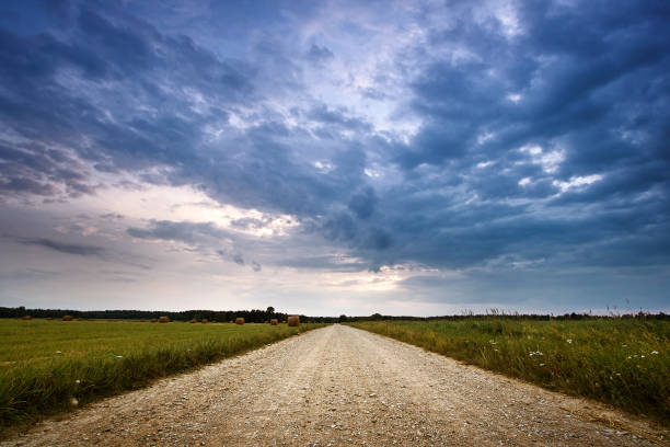 istock Evening country road with dramatic sky 505282061