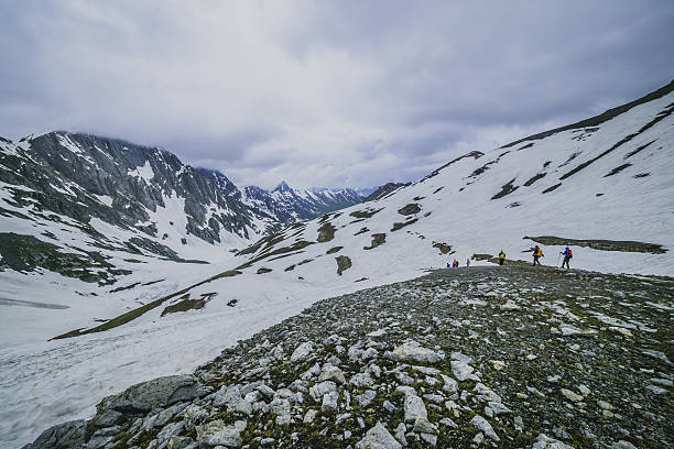 istock hiking in snow mountain 505282889