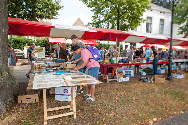 People searching for interesting books at book stalls stock photo