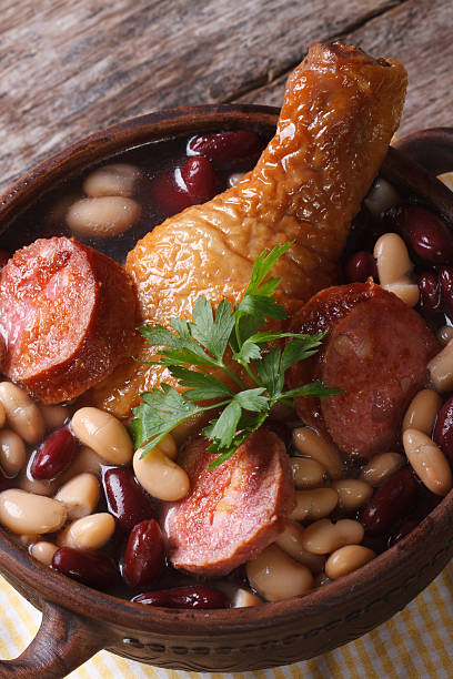 istock red and white beans with chicken legs and sausages vertical 505284259