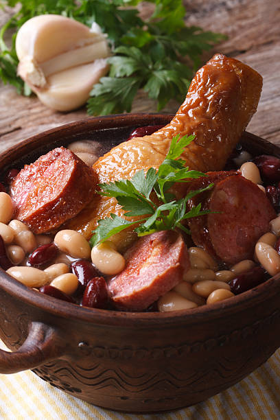 istock soup with beans, chicken legs and sausages close up vertical 505284671