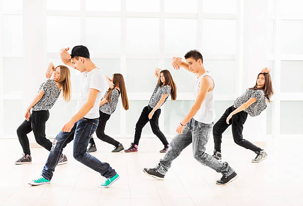 Teenage dancers. Group of teenage dancers exercising.    dance troupe stock pictures, royalty-free photos & images