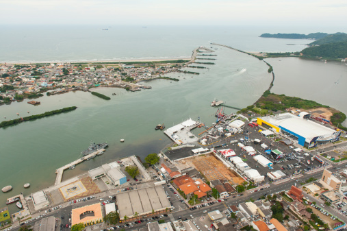 Helicopter ride over the Itajai River. The canal serves for big ship containers to reach Itajai harbor facilities. The itajai harbor exports mostly of the industrial production of Santa Catarina State based in food processing industry, textiles, ceramics and more.