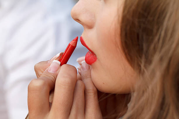 istock makeup master paint a beautiful young girl closeup 505289776