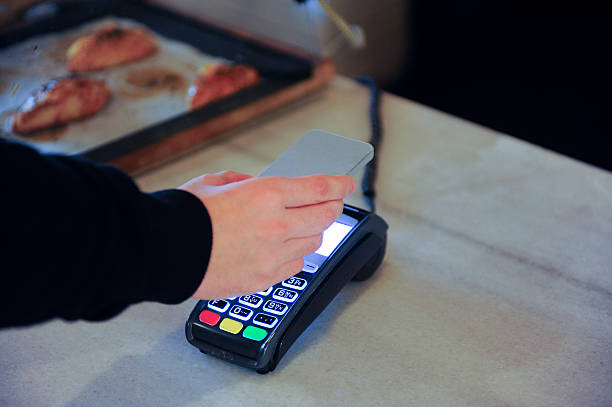 istock Man Paying With NFC Technology On Mobile Phone 505289802