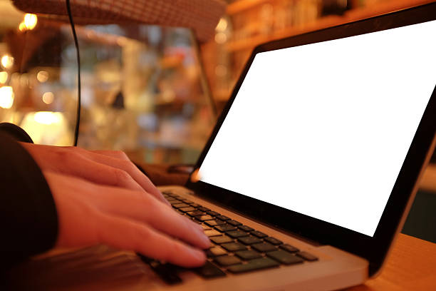 istock Man hands working with a laptop in a coffee shop 505290490