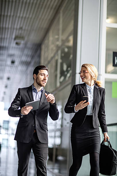 istock two business colleagues  hurrying to work 505294274