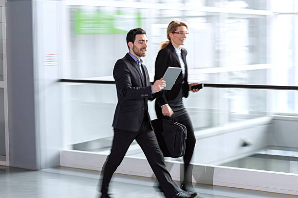 istock two business colleagues  hurrying to a meeting 505294310