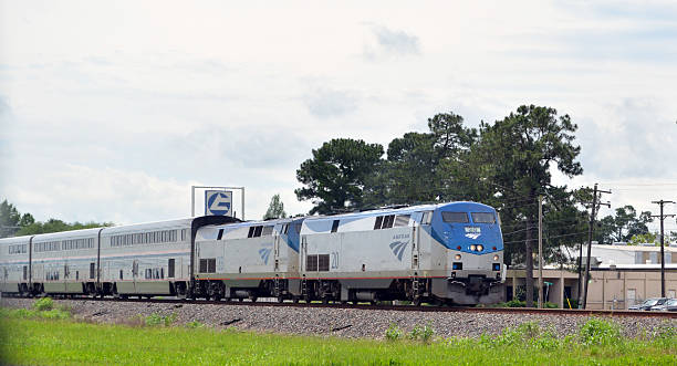 Amtrak Train Lafeyette, LA, USA - April 17, 2015: Amtrak Train traveling through town Amtrak stock pictures, royalty-free photos & images