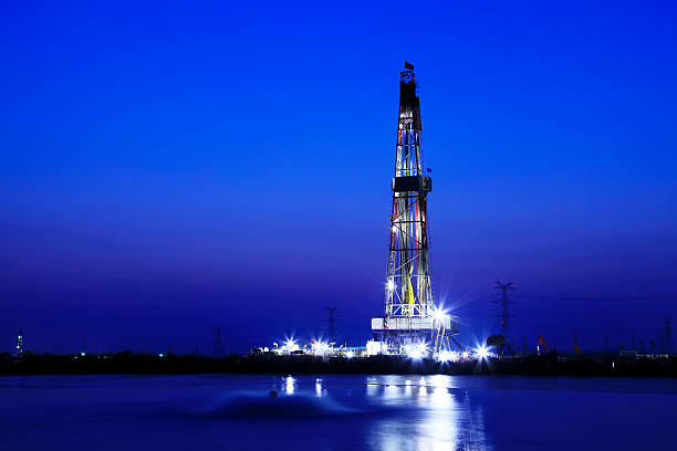 istock oilfield derrick at night 505301330