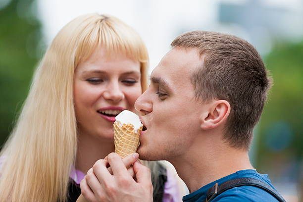 istock woman and man eating ice cream 505302499