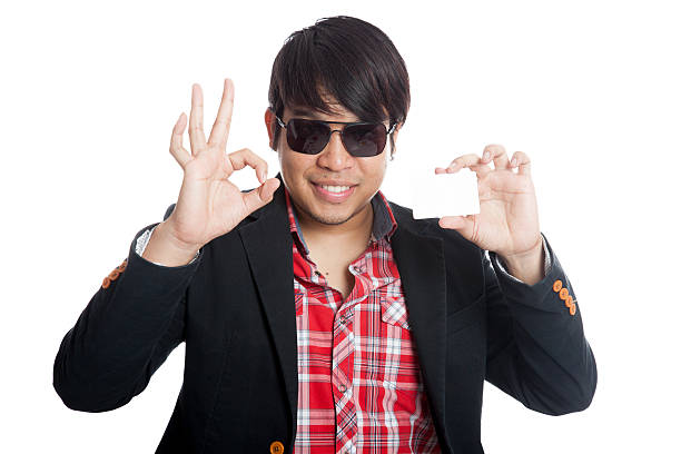 istock Asian man show OK sign with a card 505302505