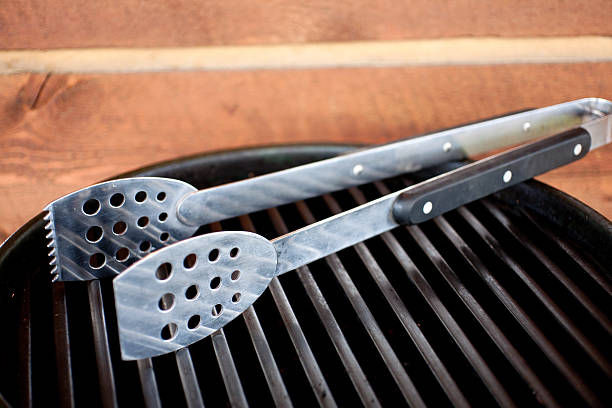 istock tongs on a grill 505303002