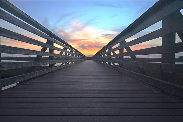 istock Wooden Boardwalk at sunset at Bolsa Chica 505303298
