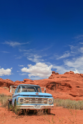 Utah, United States - August 3, 2012: An old ford truck abandoned in the desert slowly decaying