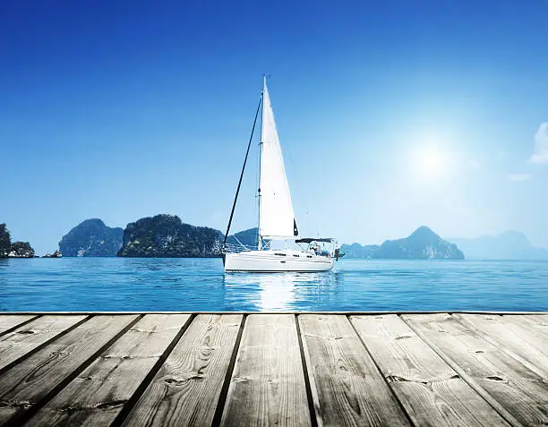 Photo of yacht and blue water ocean