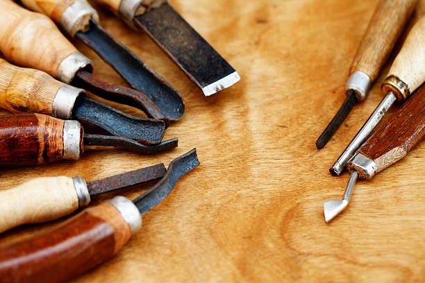 istock carving tool closeup on wooden background 505328078
