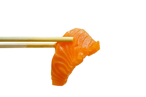 istock salmon sashimi with chopsticks isolated on white background 505328564