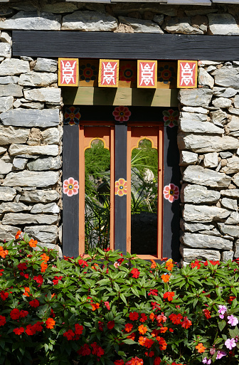 Chiang Mai, Thailand - January 2, 2016: the painting art on arch in Bhutan style at royal park rajapruek which  is the botanical garden for travelling atttraction in Chiang Mai, Thailand.