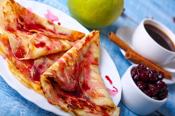 istock Breakfast pancakes with cherry jam on a blue background 505329466